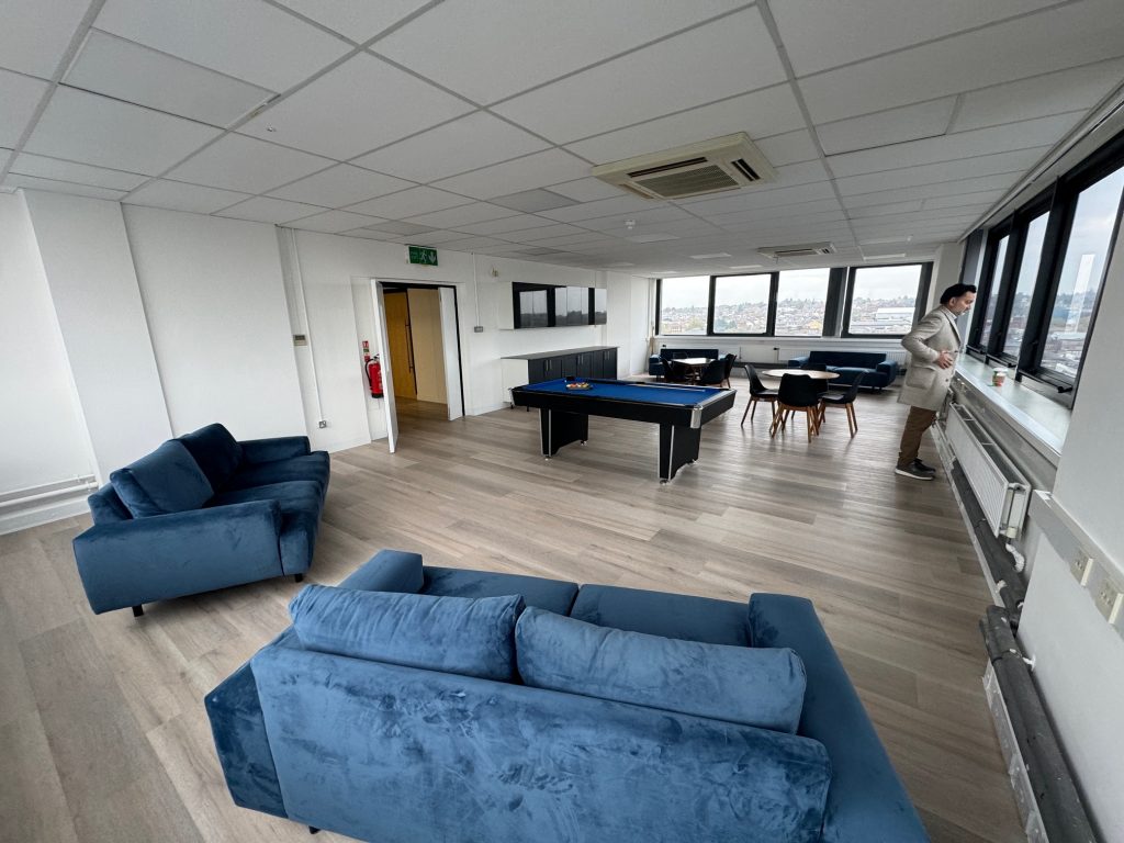 Modern office lounge with blue furniture.